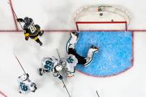 Golden Knights center Jonathan Marchessault (81) scores on San Jose Sharks goaltender Martin Jo ...