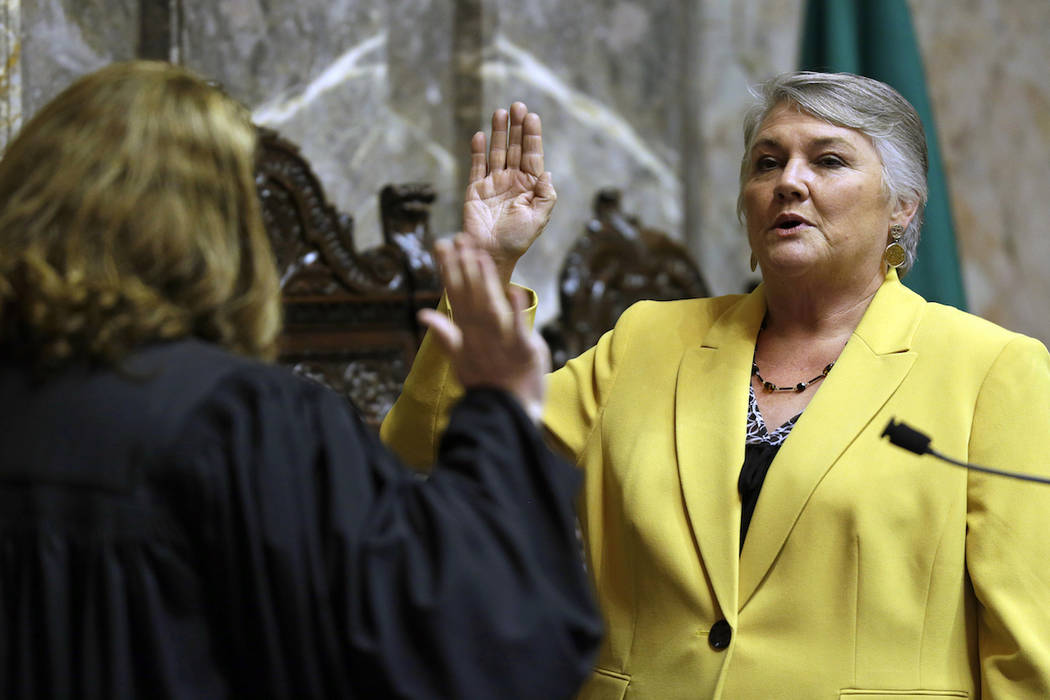 In this Jan. 9, 2017 file photo, Sen. Maureen Walsh, R-Walla Walla, right, takes the oath of of ...