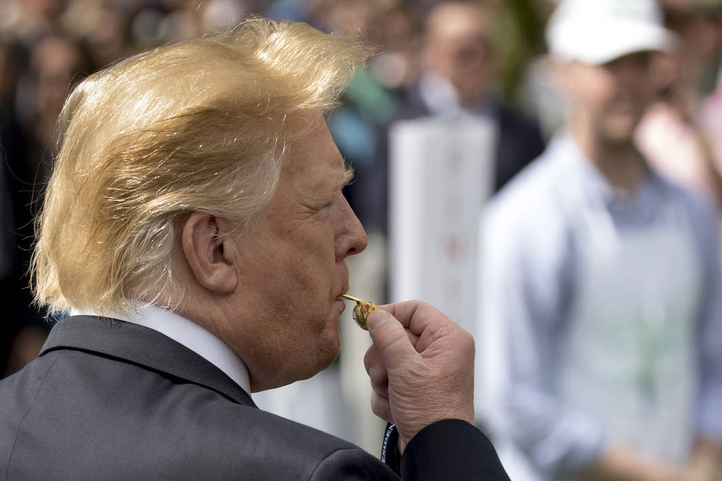 President Donald Trump blows the whistle to start a race during the annual White House Easter E ...