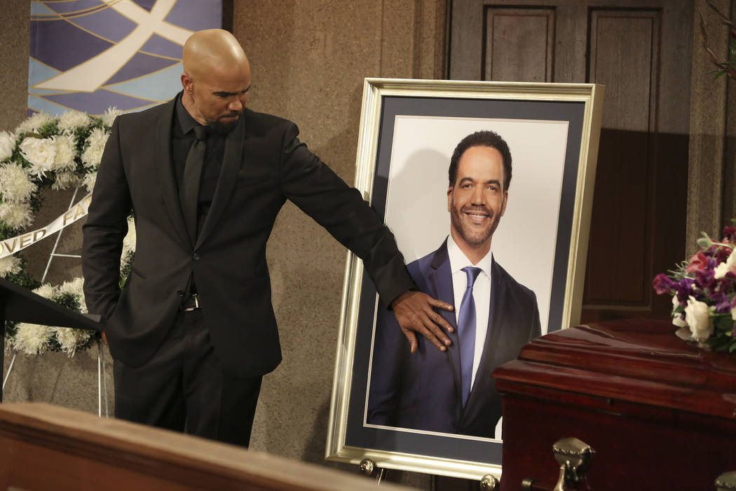 This image released by CBS shows Shemar Moore portraying Malcolm Winters during a funeral scene ...