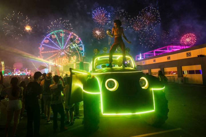 Deven Williams of the Kalliope dances on an art car as fireworks go off during the third day of ...