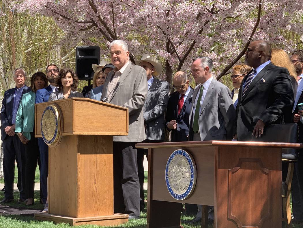 Nevada Gov. Steve Sisolak speaks Monday in Carson City at the signing of a bill committing the ...