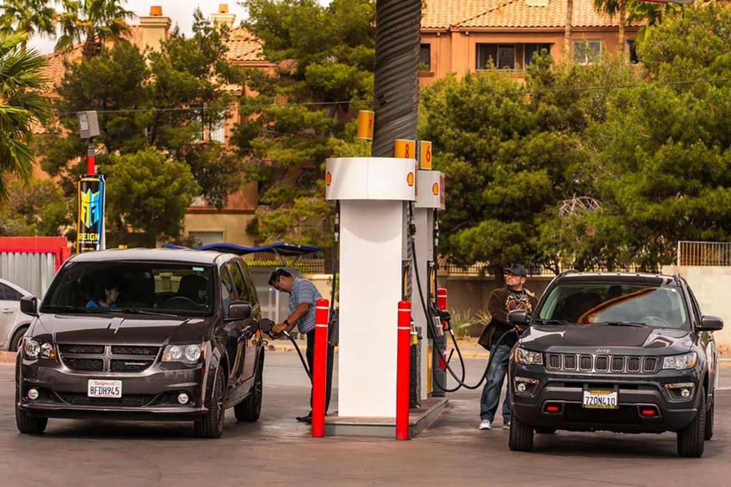 Patrons pump gas at a station on Flamingo Road at Koval Lane on Monday, April 15, 2019, in Las ...