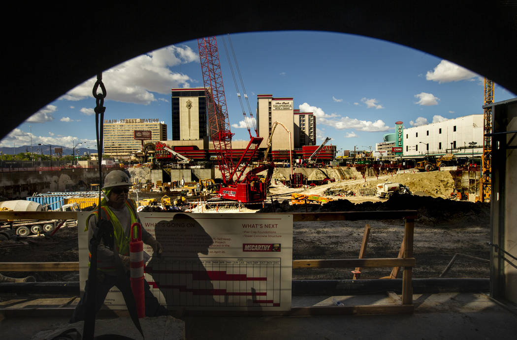 Construction continues at the under-development Circa viewed from a porthole in the Fremont exp ...