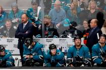 San Jose Sharks coach Peter DeBoer, left rear, stands in the bench area during the second perio ...