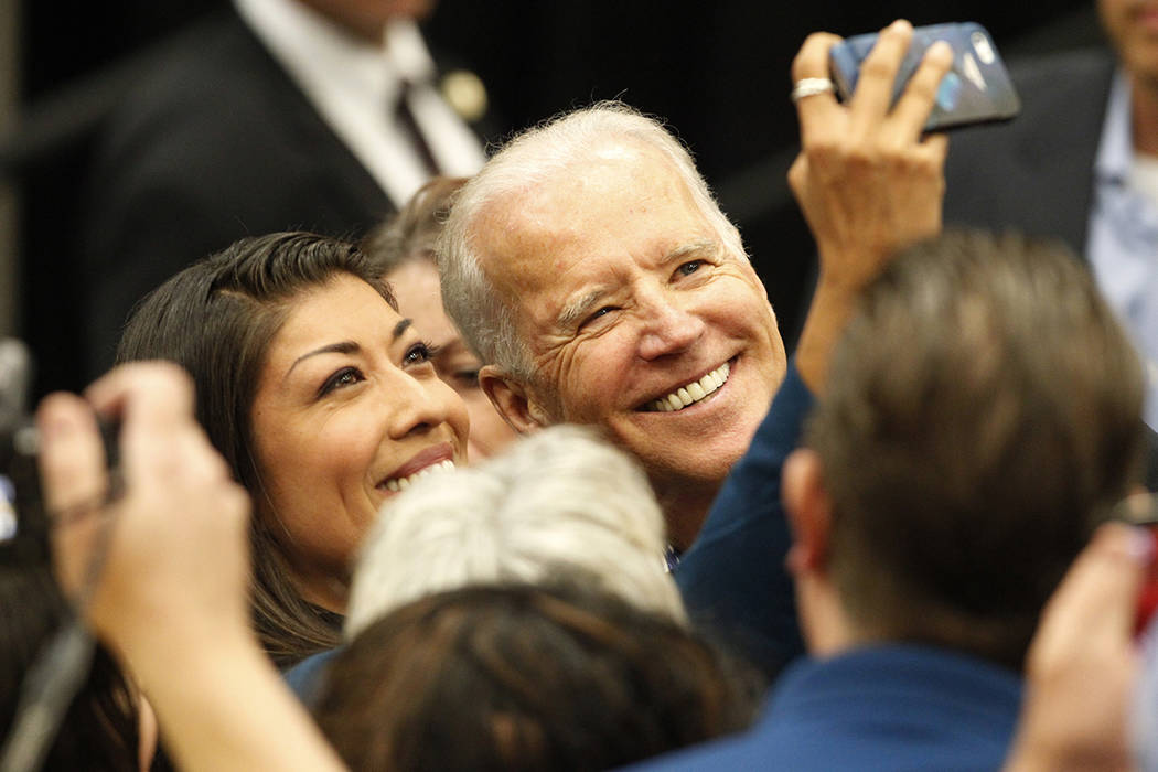 Lucy Flores, left, and Vice President Joe Biden take a photo together during a get out the vote ...
