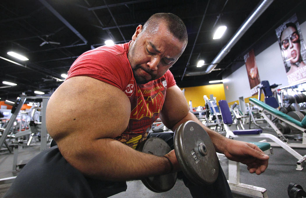 Egyptian body builder Moustafa Ismail lifts free weights Nov. 16, 2012, during his daily workou ...