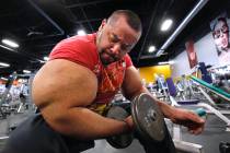 Egyptian body builder Moustafa Ismail lifts free weights Nov. 16, 2012, during his daily workou ...