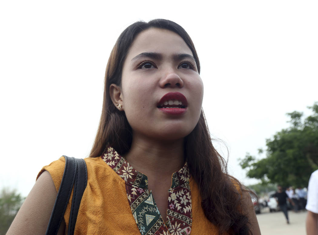 Chit Su Win, wife of Reuters journalist Kyaw Soe Oo, talks to journalists as she leaves the Sup ...