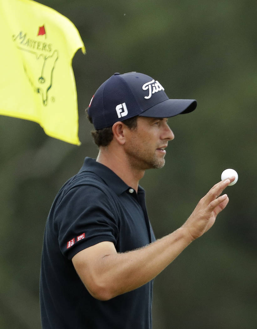 Adam Scott, of Australia, waves on the 18th holeduring the final round for the Masters golf tou ...