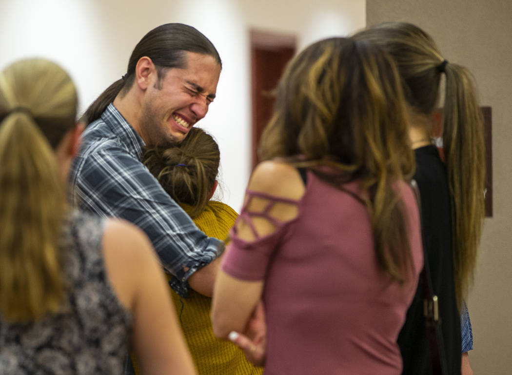 Family members and supporters comfort each other after former Metro officer Pamela Bordeaux, ch ...