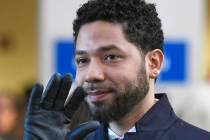 Actor Jussie Smollett smiles and waves to supporters March 26, 2019, before leaving Cook County ...
