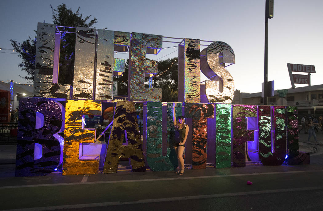 A festival-goer poses at a Life is Beautiful sign on Day 2 of the annual Life is Beautiful fest ...