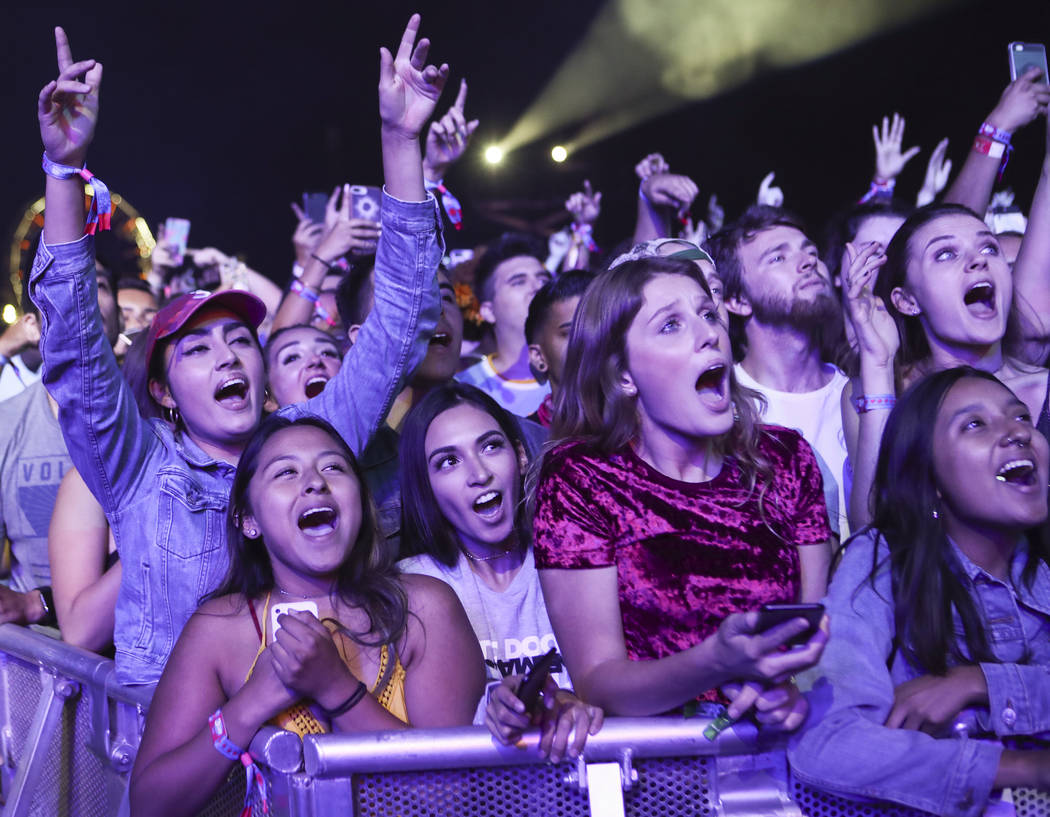 Fans react as Chance the Rapper performs on the first day of the Life is Beautiful festival in ...