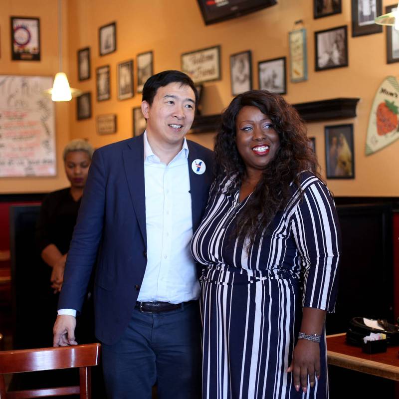 Democratic presidential candidate Andrew Yang, left, takes a photo with Shannon Churchwell, cha ...