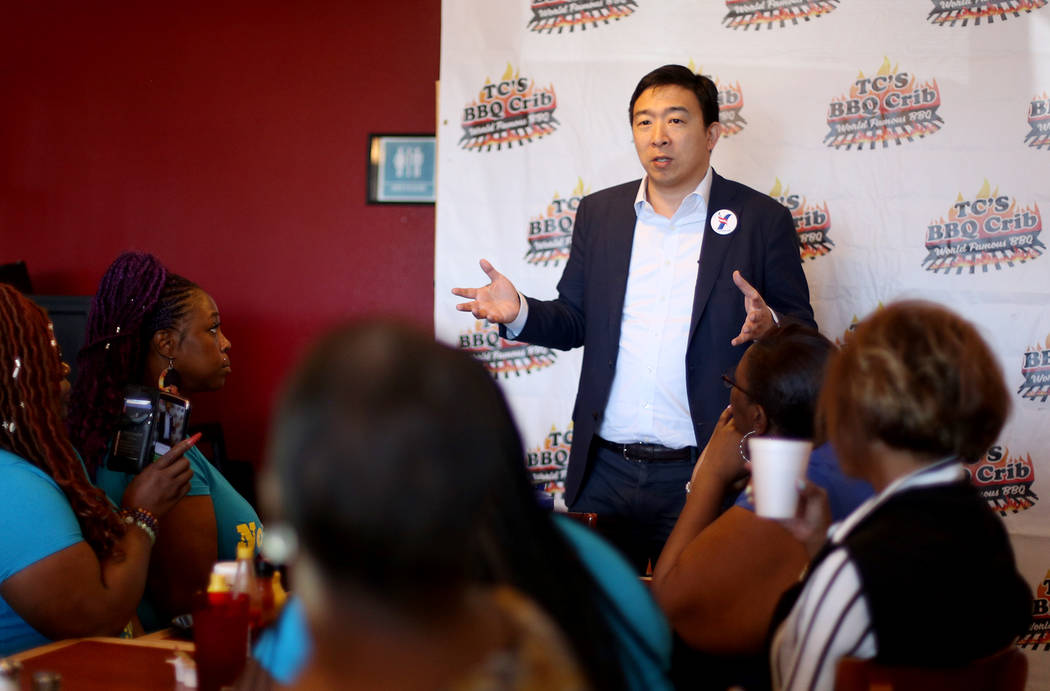 Democratic presidential candidate Andrew Yang addresses a room of parents of the black Arbor Vi ...