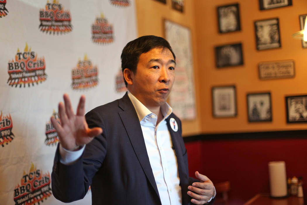 Democratic presidential candidate Andrew Yang addresses a room of parents of the black Arbor Vi ...