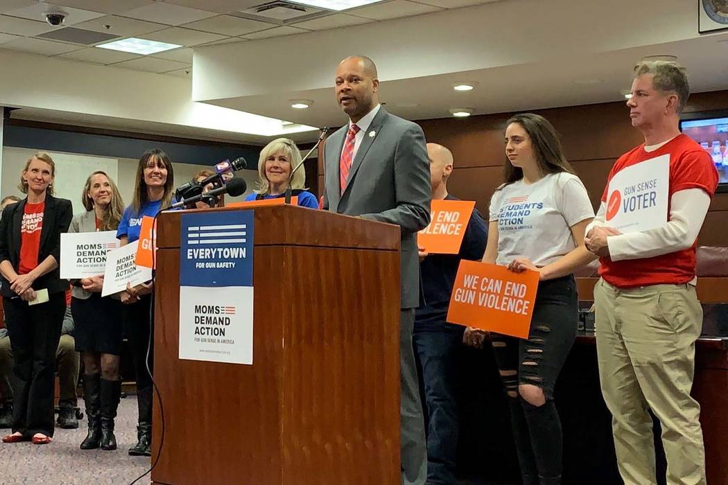 Nevada Attorney General Aaron Ford stands with supporters on Tuesday, Feb. 12, 2019, as he anno ...