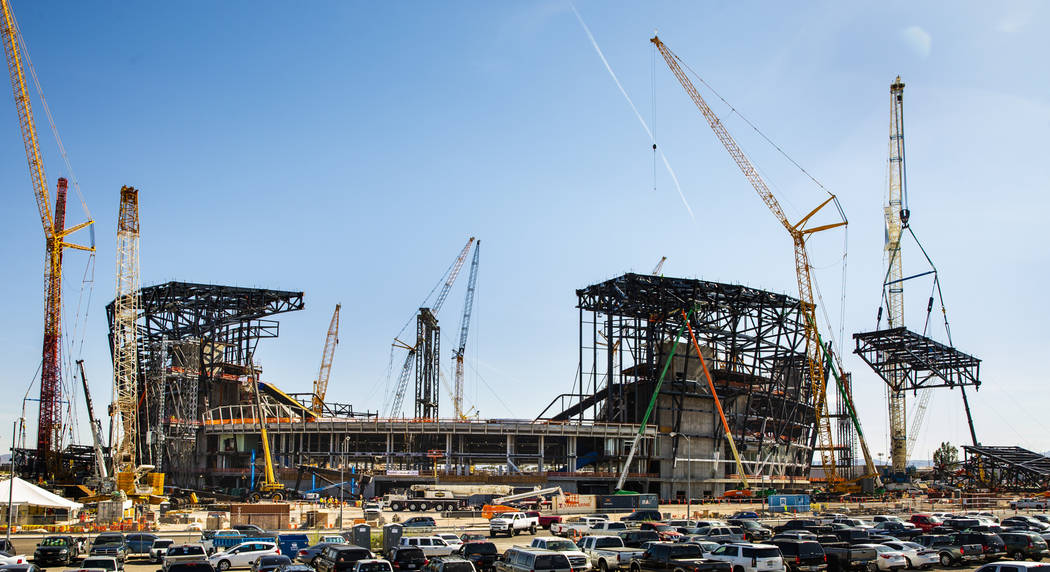 The newest truss is lifted and soon attached to the top of Raiders Stadium on Wednesday, May 1, ...