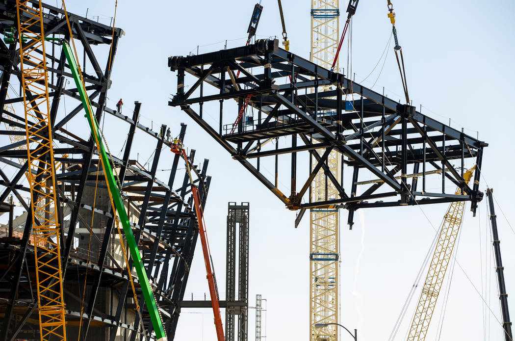 The newest truss is lifted and soon attached to top of Raiders Stadium on Wednesday, May 1, 201 ...