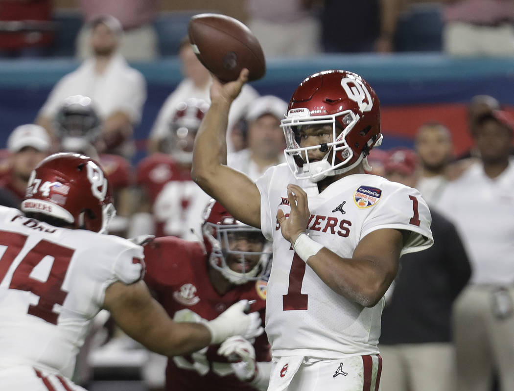 Oklahoma quarterback Kyler Murray (1) looks to pass, during the first half of the Orange Bowl N ...
