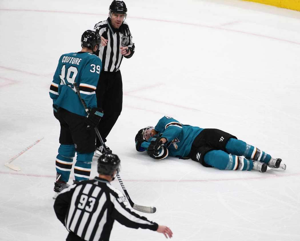 Sharks center Joe Pavelski (8) lays on the ice after getting hit by Knights center Cody Eakin ( ...
