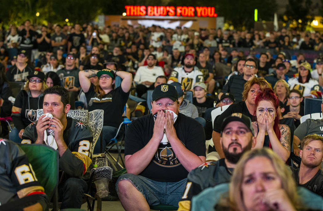 Golden Knights fans Randy Trent, Michael and Rebecca Moore sit dismayed as the San Jose Sharks ...