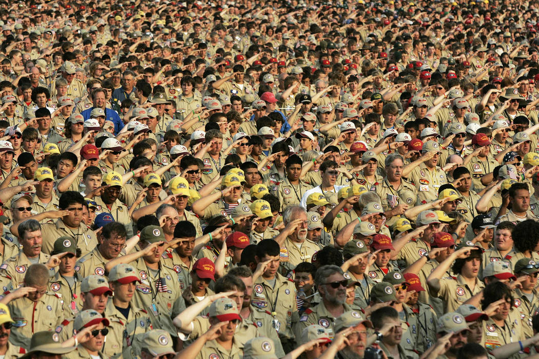 Boy Scouts salute as they recite the Pledge of Allegiance July 31, 2005, during the Boy Scout J ...