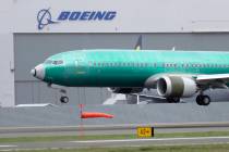 A Boeing 737 MAX 8 airplane being built for India-based Jet Airways lands following a test flig ...