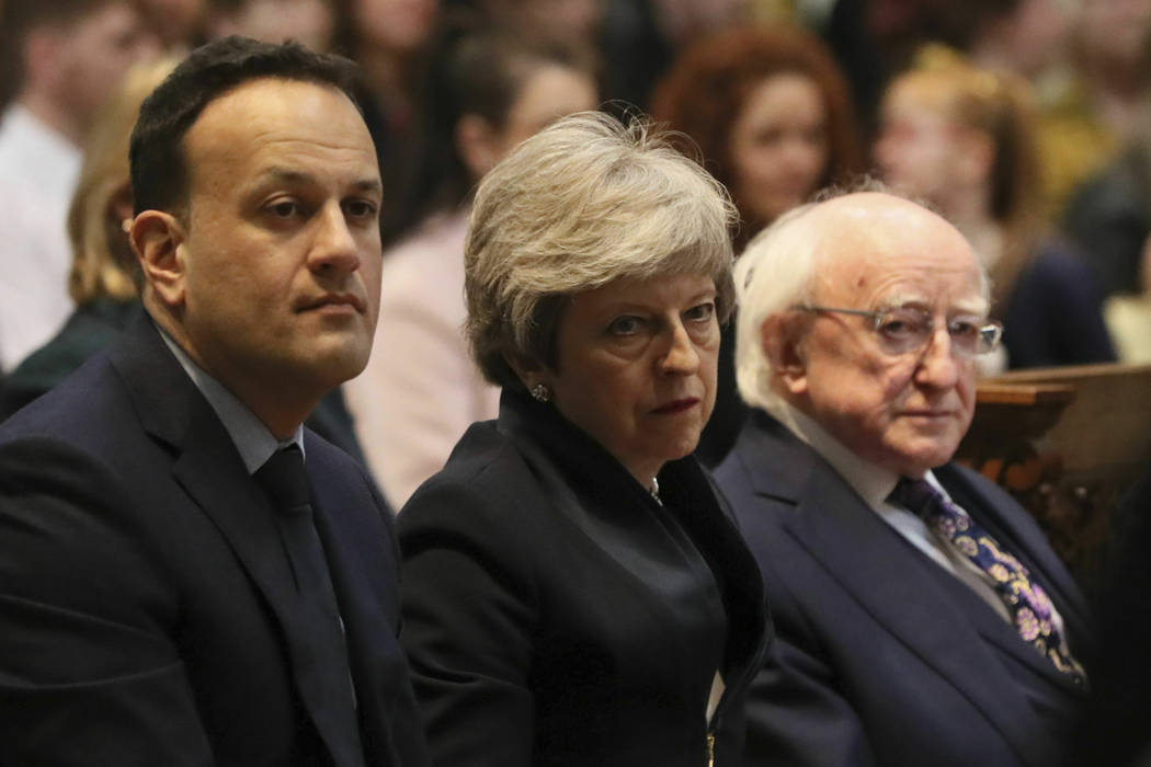 Ireland's Prime Minister Leo Varadkar, left, Britain's Prime Minister Theresa May and Irish Pre ...