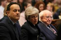 Ireland's Prime Minister Leo Varadkar, left, Britain's Prime Minister Theresa May and Irish Pre ...