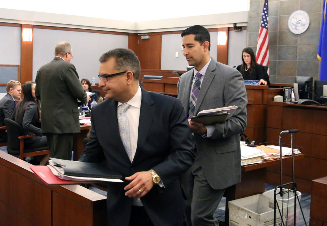 Defense attorney Christopher Oram, left, who represents former LVCVA executive Brig Lawson, and ...