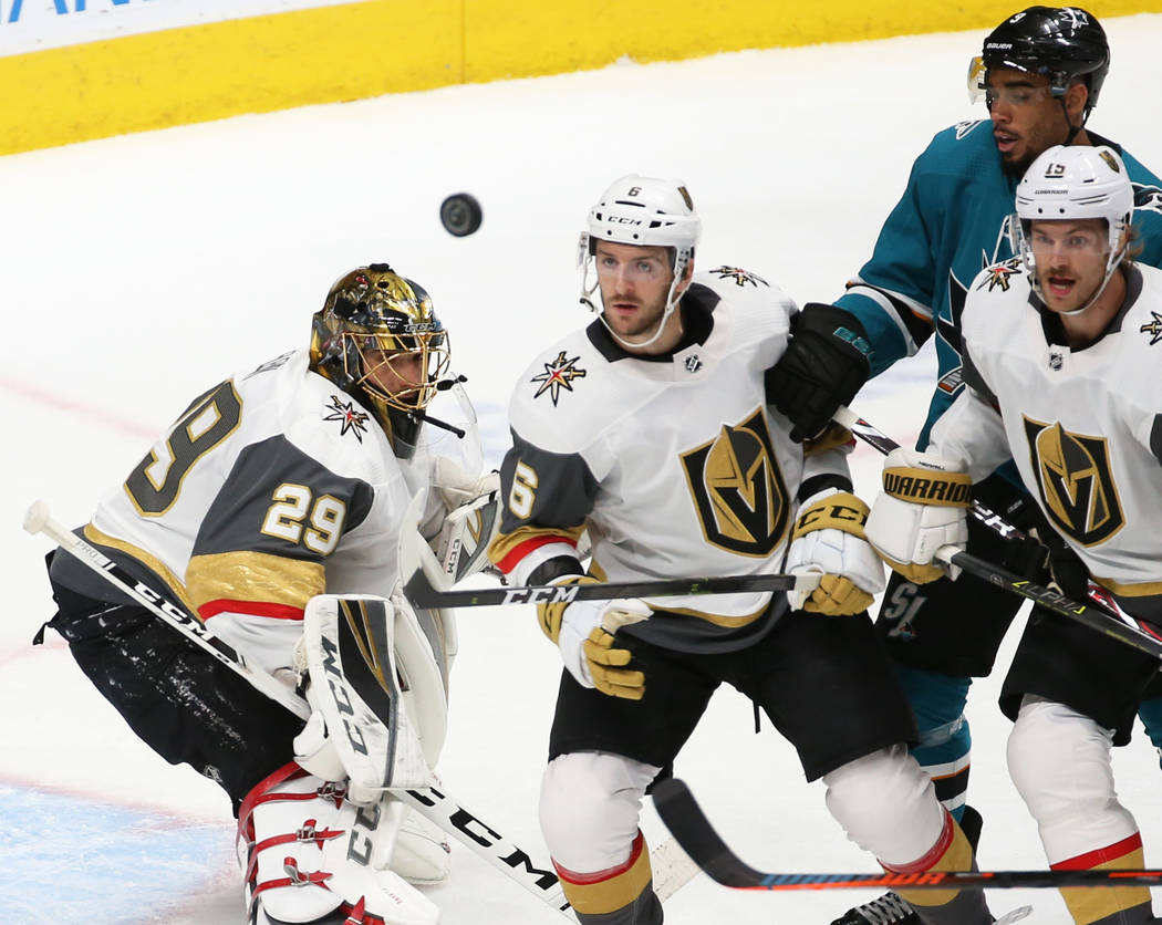 Golden Knights goaltender Marc-Andre Fleury (29) makes a save in the first period with the help ...