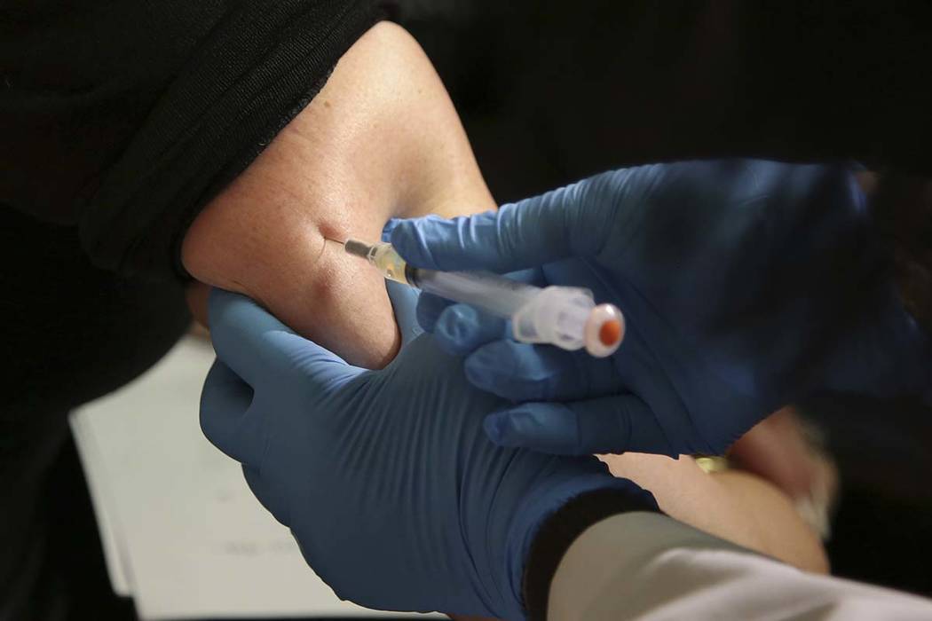 A woman receives a measles, mumps and rubella vaccine on March 27, 2019, at the Rockland County ...