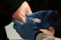 A woman receives a measles, mumps and rubella vaccine on March 27, 2019, at the Rockland County ...