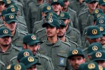 FILE - In this Feb. 11, 2019 file photo, Iranian Revolutionary Guard members attend a ceremony ...