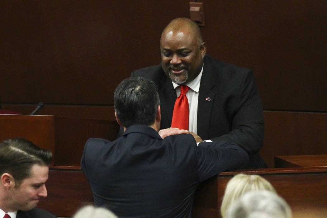 Assembly Speaker Jason Frierson greets Nevada Gov. Brian Sandoval following the State of the St ...
