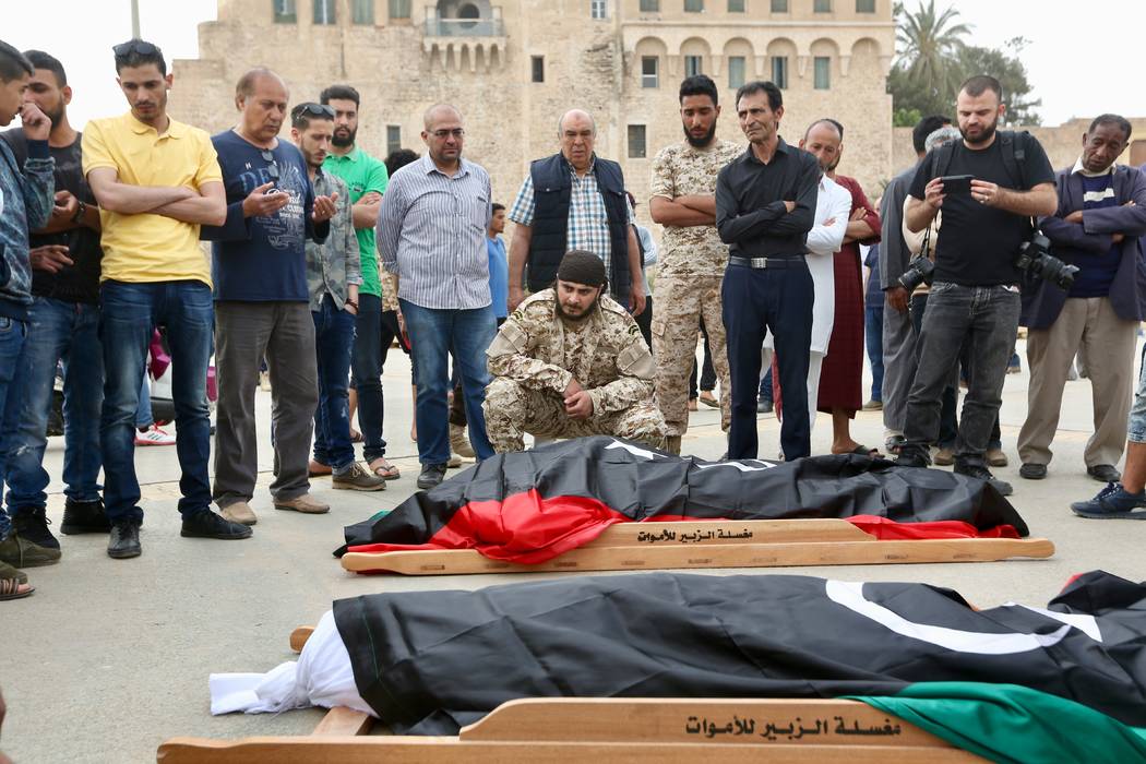 Mourners gather for funeral prayers for fighters killed by warplanes of Field Marshal Khalifa H ...