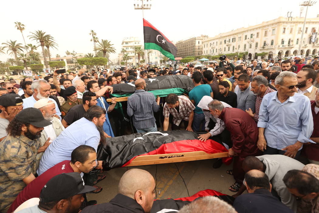Mourners gather for funeral prayers for fighters killed by warplanes of Field Marshal Khalifa H ...