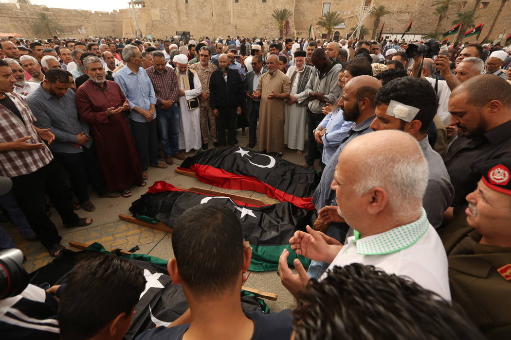 Mourners gather for funeral prayers for fighters killed by warplanes of Field Marshal Khalifa H ...