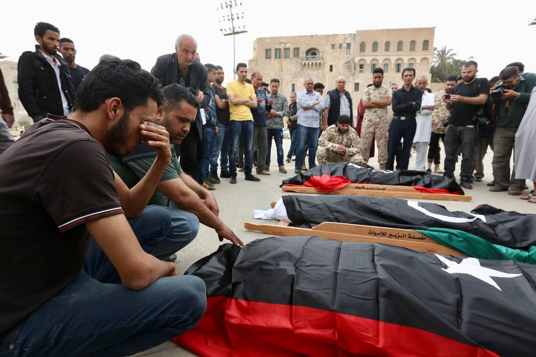 Mourners gather for funeral prayers for fighters killed by warplanes of Field Marshal Khalifa H ...