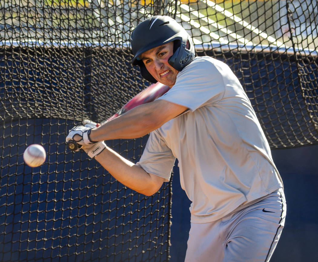 The Meadows School third baseman Sam Kaplan eyes a pitch during hitting practice, he will play ...