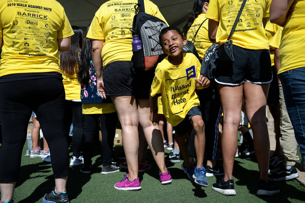 Alex Saunders, 6, from Las Vegas runs through a crowd of people during the Anti-Defamation Leag ...