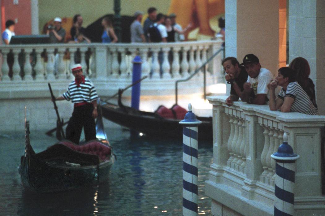 A gondola operator floats on the Grand Canal in the Venetian on Wednesday afternoon. Wednesday ...