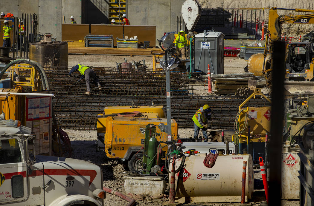Construction continues at the under-development Circa viewed from a porthole in the Fremont exp ...