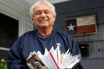 Rex Teter, a member of the Electoral College, holds two days of delivered mail at his home in P ...