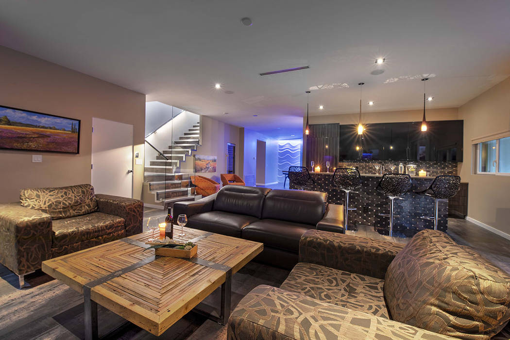 A room downstairs has a bar and sitting areas. (Sotherby’s International Realty, Synergy)