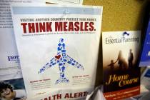 FILE - In this Feb. 6, 2015, file photo, a flyer educating parents about measles is displayed o ...