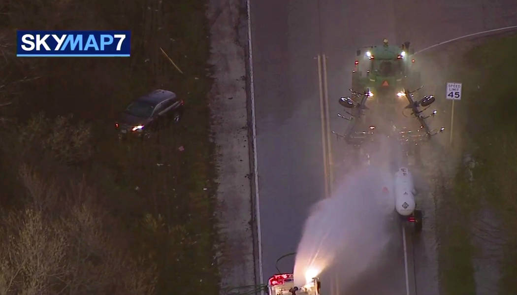 In this image made from video provided by ABC7 Chicago, a fire engine sprays water on a contain ...