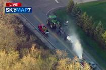 In this still image from video provided by ABC7 Chicago, a fire engine sprays water on a contai ...